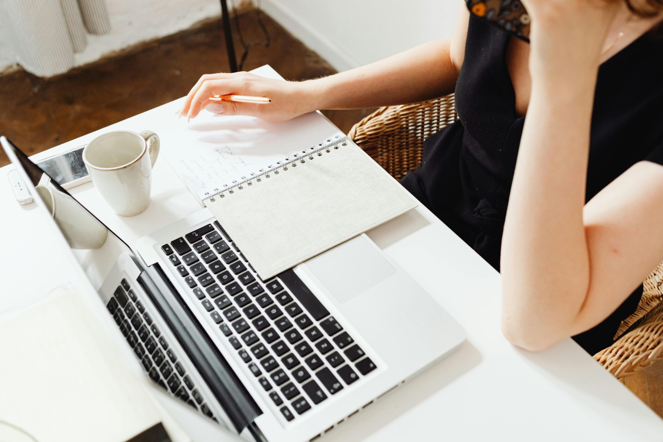 A professional woman planning typical career goals in a modern workspace.